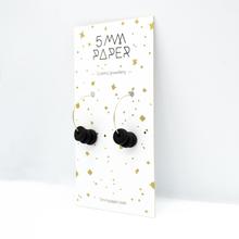 Gold hoop earrings with black disk beads