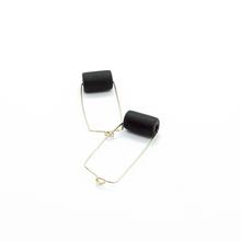 Gold rectangular earrings with a black bead