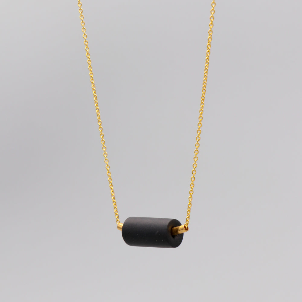 Gold black tube bead necklace