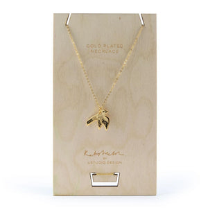 Necklace with a Swallow bird pendant in gold by Katy Welsh