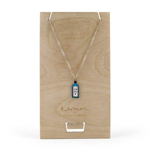 Necklace with a blue Gin bottle pendant in silver by Katy Welsh