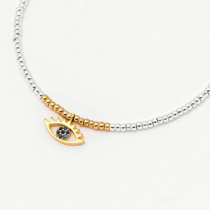 Bracelet with 'Evil eye' blue charm in gold and silver
