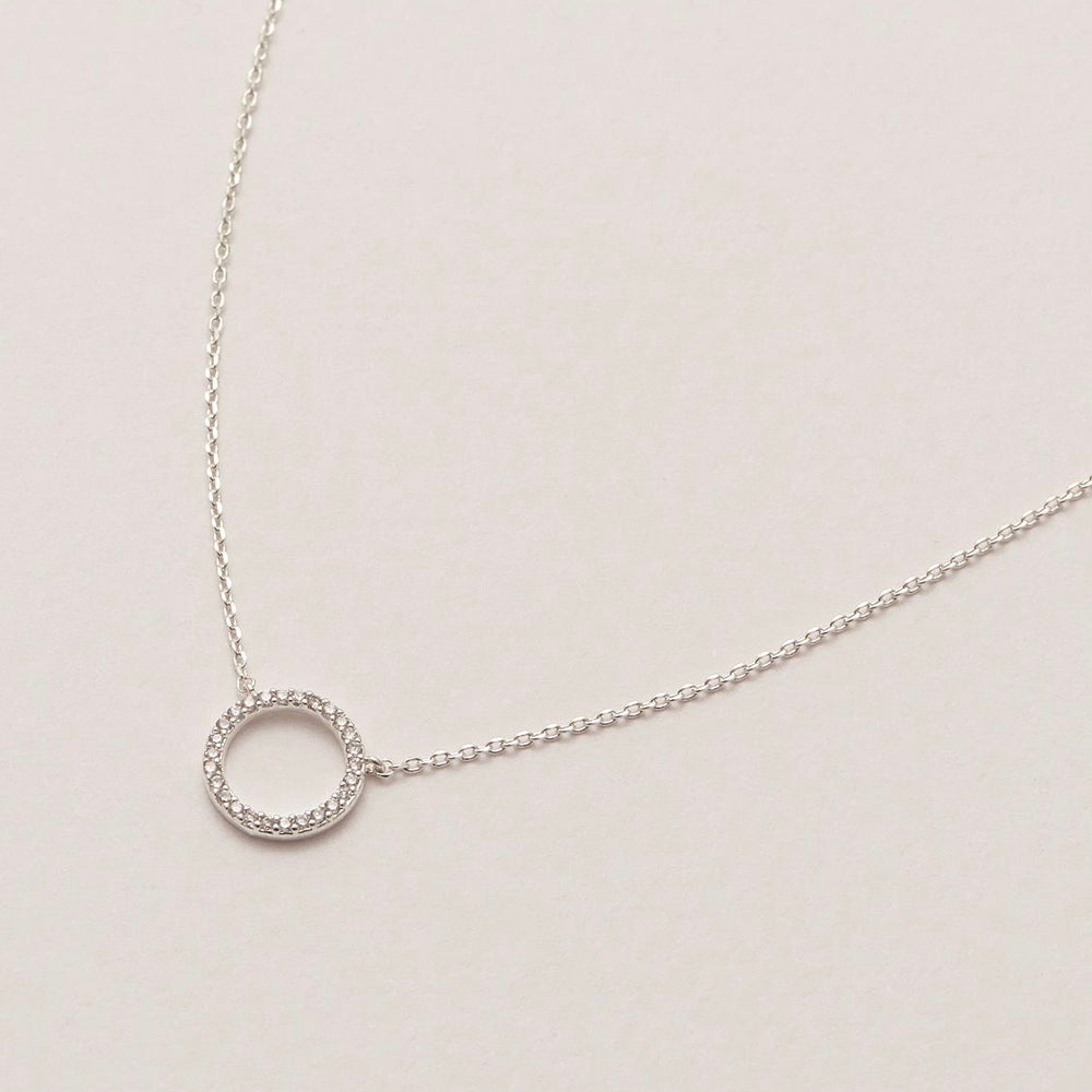 Necklace with a encrusted circle pendant in silver