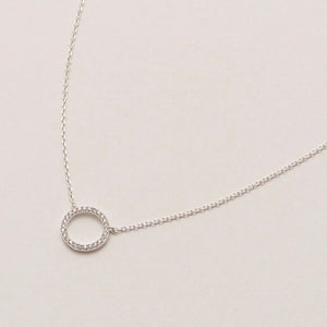 Necklace with a encrusted circle pendant in silver