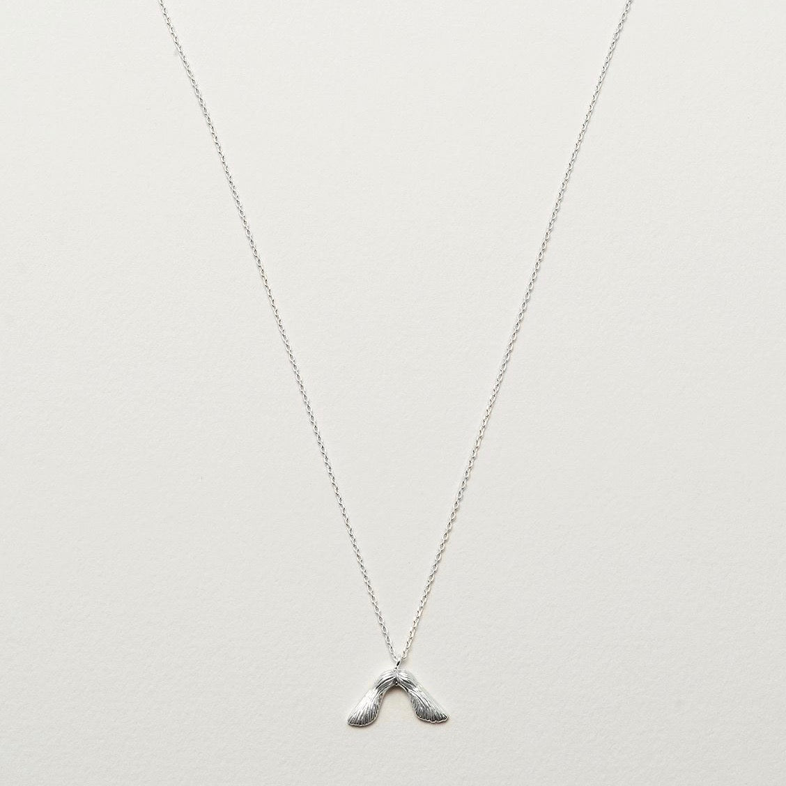Necklace with maple seed pendant in silver