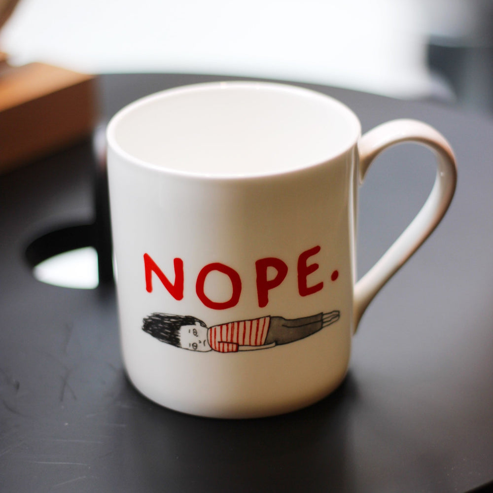 Mug with 'Nope' in white by Gemma Correll