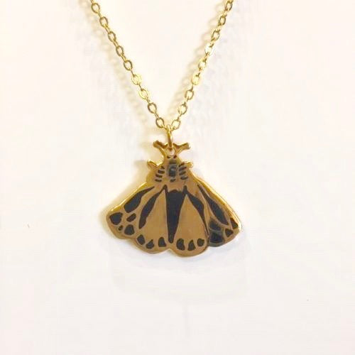 Necklace with a moth pendant in gold by Katy Welsh