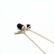 Triple charm gold necklace